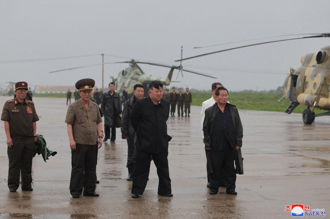 North Korea's leader Kim Jong Un (C) inspecting the area for flood damage after record-breaking heavy rains in the city of Sinuiju, North Pyongan province. (AFP)