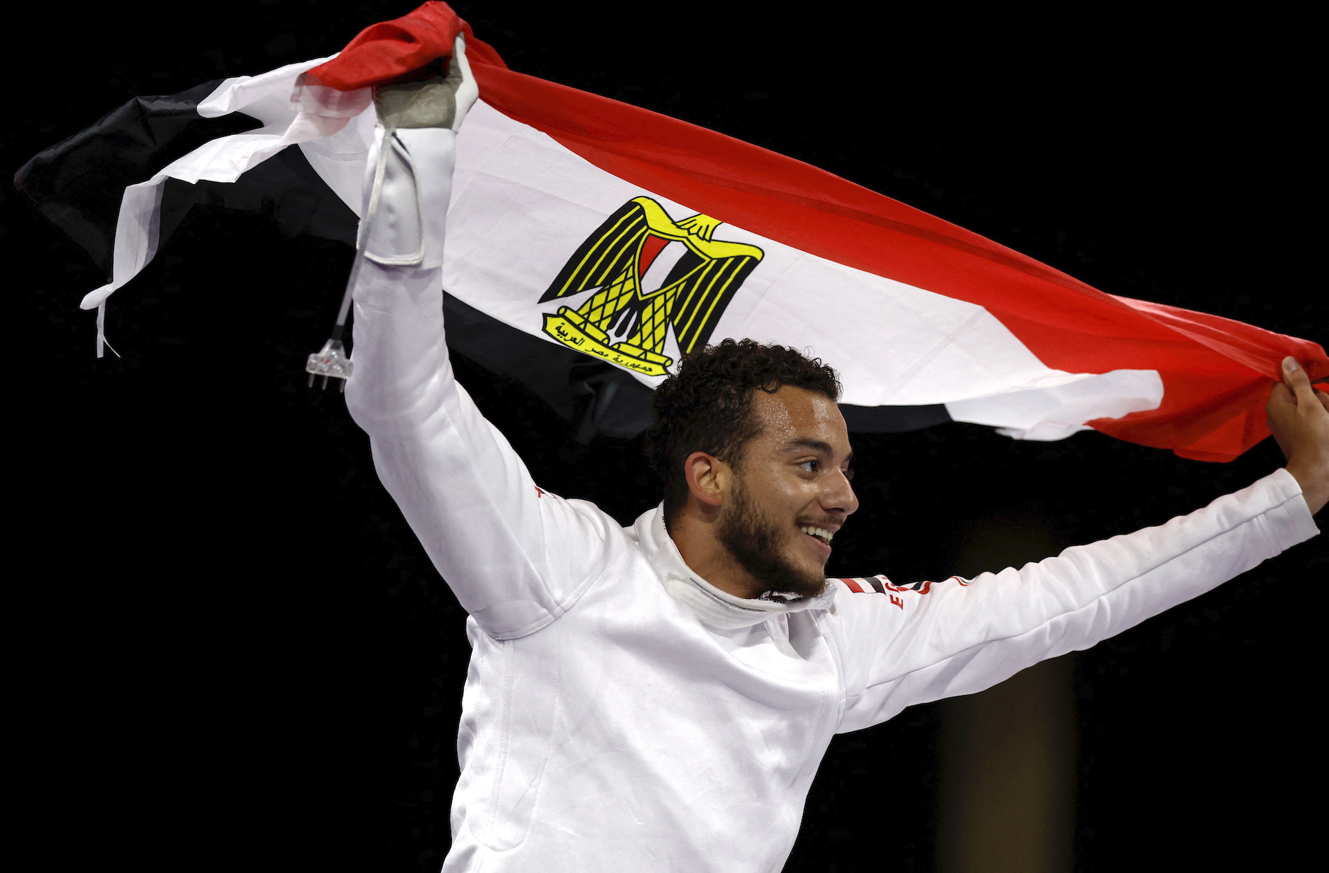 Mohamed Elsayed of Egypt celebrates with Egypt flag after winning his bronze medal bout against Tibor Ferenc Andrasfi of Hungary. (Reuters)