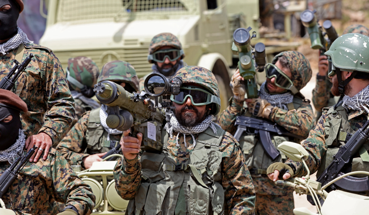 Lebanese Hezbollah fighters take part in cross-border raids, part of large-scale military exercise, in Aaramta bordering Israel on May 21, 2023 ahead of the anniversary of Israel's withdrawal from southern Lebanon in 2000. (AFP)