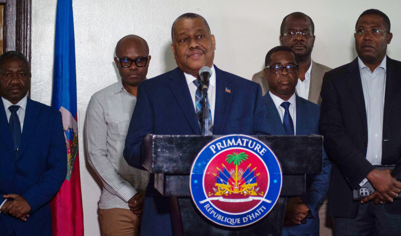 Haiti's Prime Minister Garry Conille speaks to the press on his return to Port-au-Prince, July 6, 2024, after travelling to the US and meeting with the UN Security Council. (AFP)