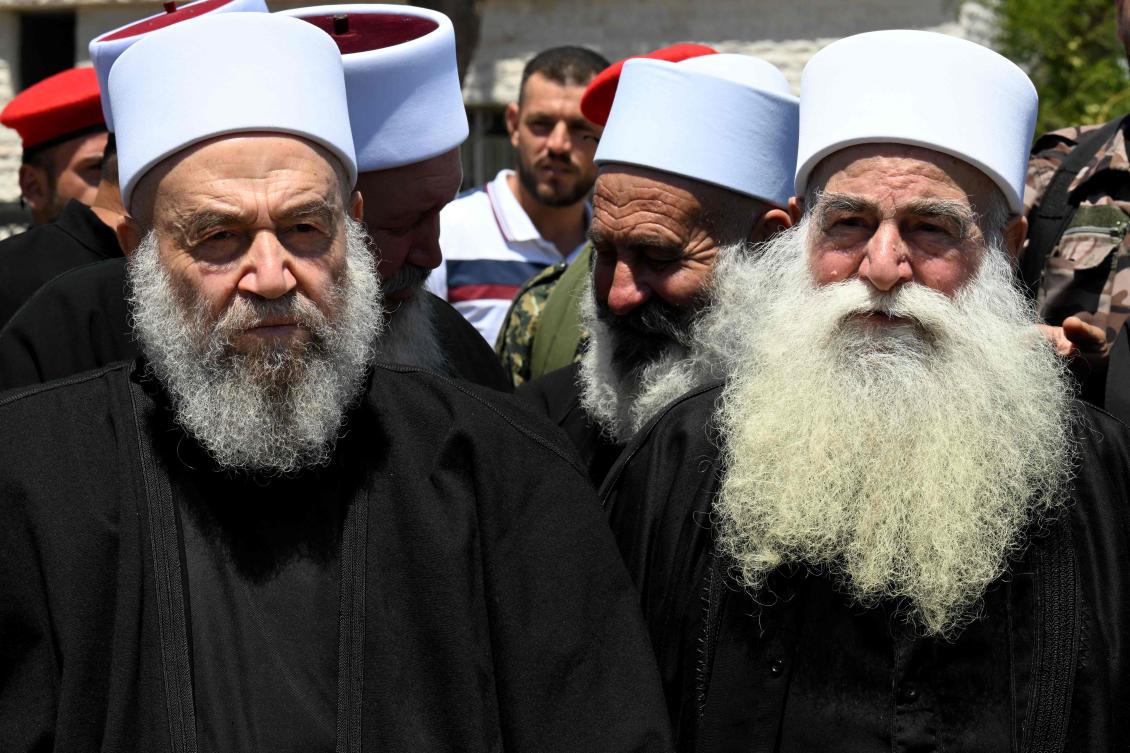 Elderly members of the Druze community gather in solidarity with the victims of the attack in Majdal Shams, on July 30, 2024, in the Syrian town of Quneitra, close to the Israeli-annexed Golan Heights. (AFP)