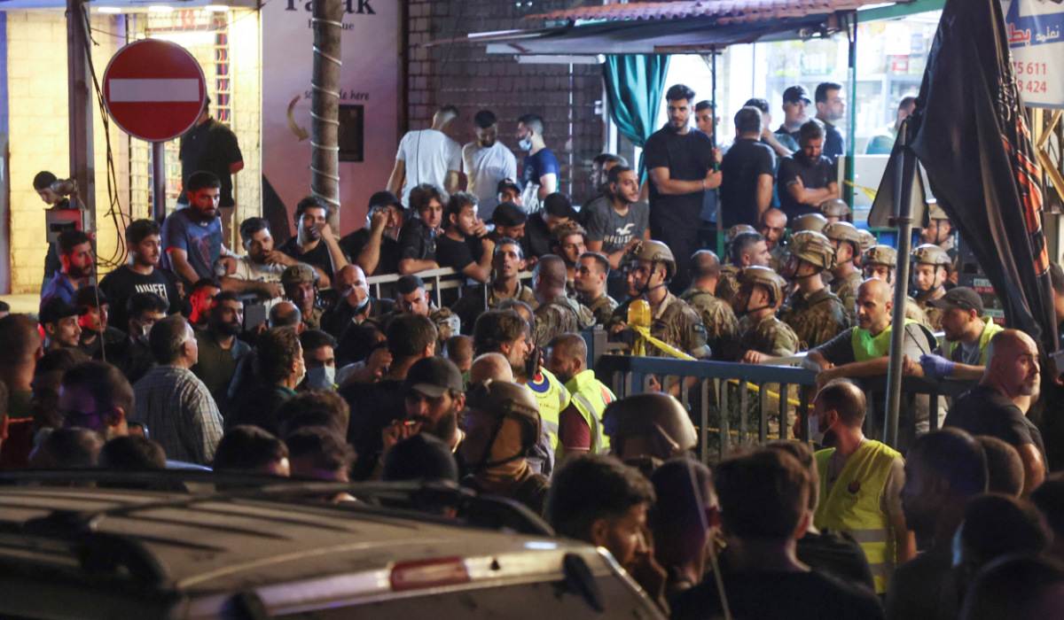 Members of the Lebanese army and people gather near a damaged site after what security sources said was a strike on Beirut's southern suburbs, Lebanon July 30, 2024. (REUTERS)
