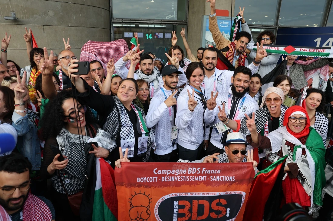 Palestinian Olympic athletes and members of the delegation were welcomed in Paris Charles-de-Gaulle airport in Roissy-en-France, north of Paris, on July 25, 2024, ahead of the Paris 2024 Olympic Games. (Photo by Ahmad GHARABLI / AFP)