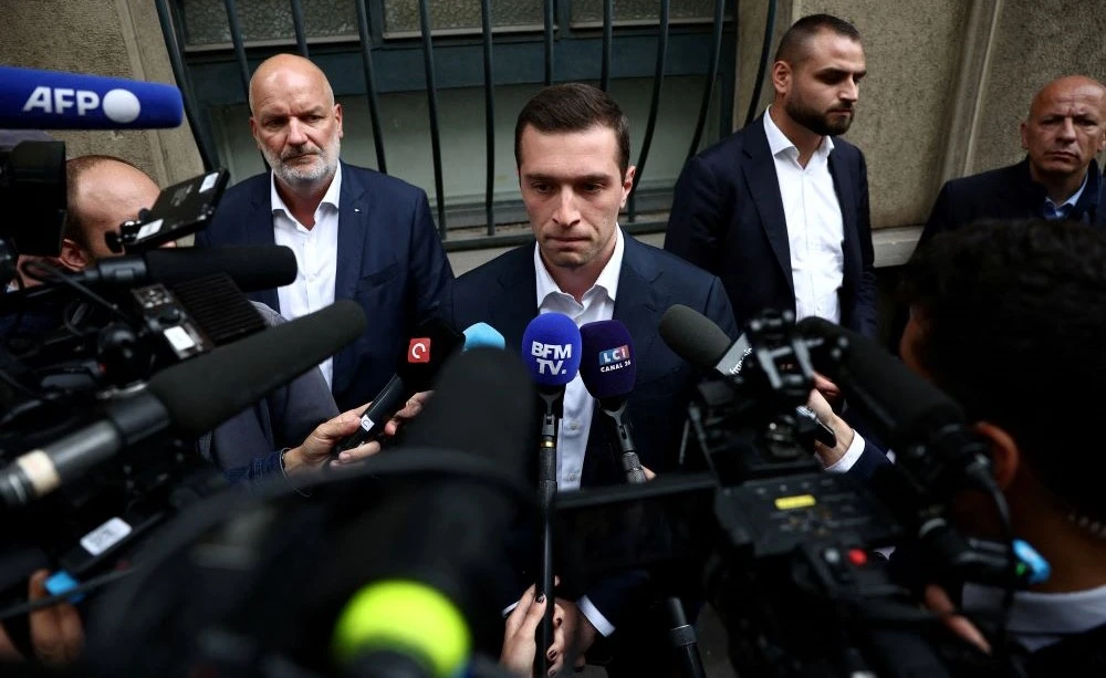 Jordan Bardella talks to journalists in Paris, France, July 8, 2024. (Reuters)