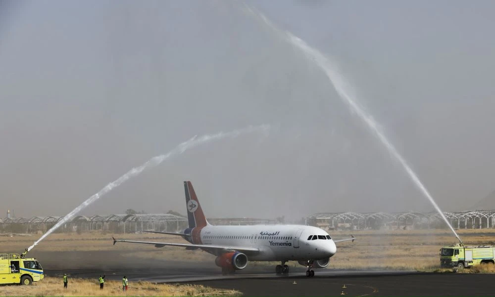 A Yemen Airways plane is greeted with water canon salute at Sanaa Airport after the resumption of commercial flights, Sanaa, Yemen, May 16, 2022. (Reuters)