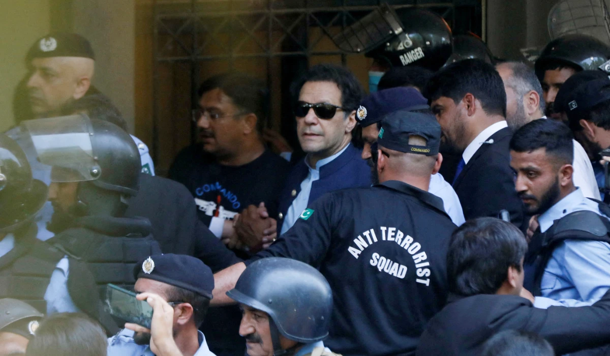 Security officers escort Pakistan's former Prime Minister Imran Khan, as he appeared in Islamabad High Court, Islamabad, Pakistan May 12, 2023. (REUTERS)