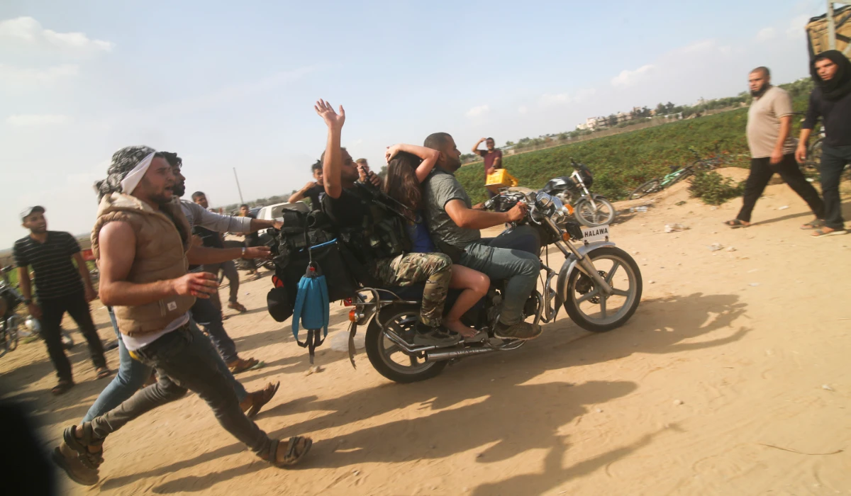 Palestinians transport a captured Israeli civilian, Noa Argamani, on a motorcycle from southern Israel, in the Gaza Strip on Oct. 7, 2023. (AP)