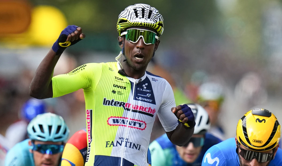 Eritrea's Biniam Girmay celebrates winning ahead of Colombia's Fernado Gavira, right, during the third stage of the Tour de France cycling race over 230.8 kilometers (143.4 miles) with start in Piacenza and finish in Turin Monday. (AP)