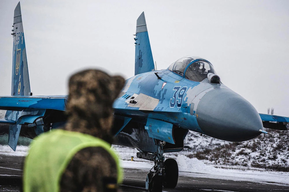 Above, a Sukhoi Su-27 fighter jet preps for a flight at the Myrhorod airfield in Ukraine’s Poltava region on Feb. 11, 2022. (Ministry of Defense Ukraine/AFP)
