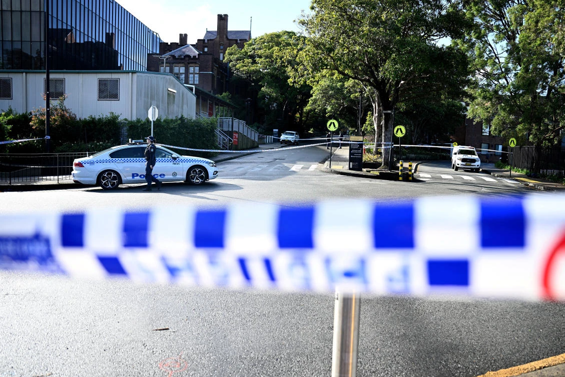 Above, New South Wales police work at the scene of an alleged stabbing at the University of Sydney on July 2, 2024. (AAP via Reuters)