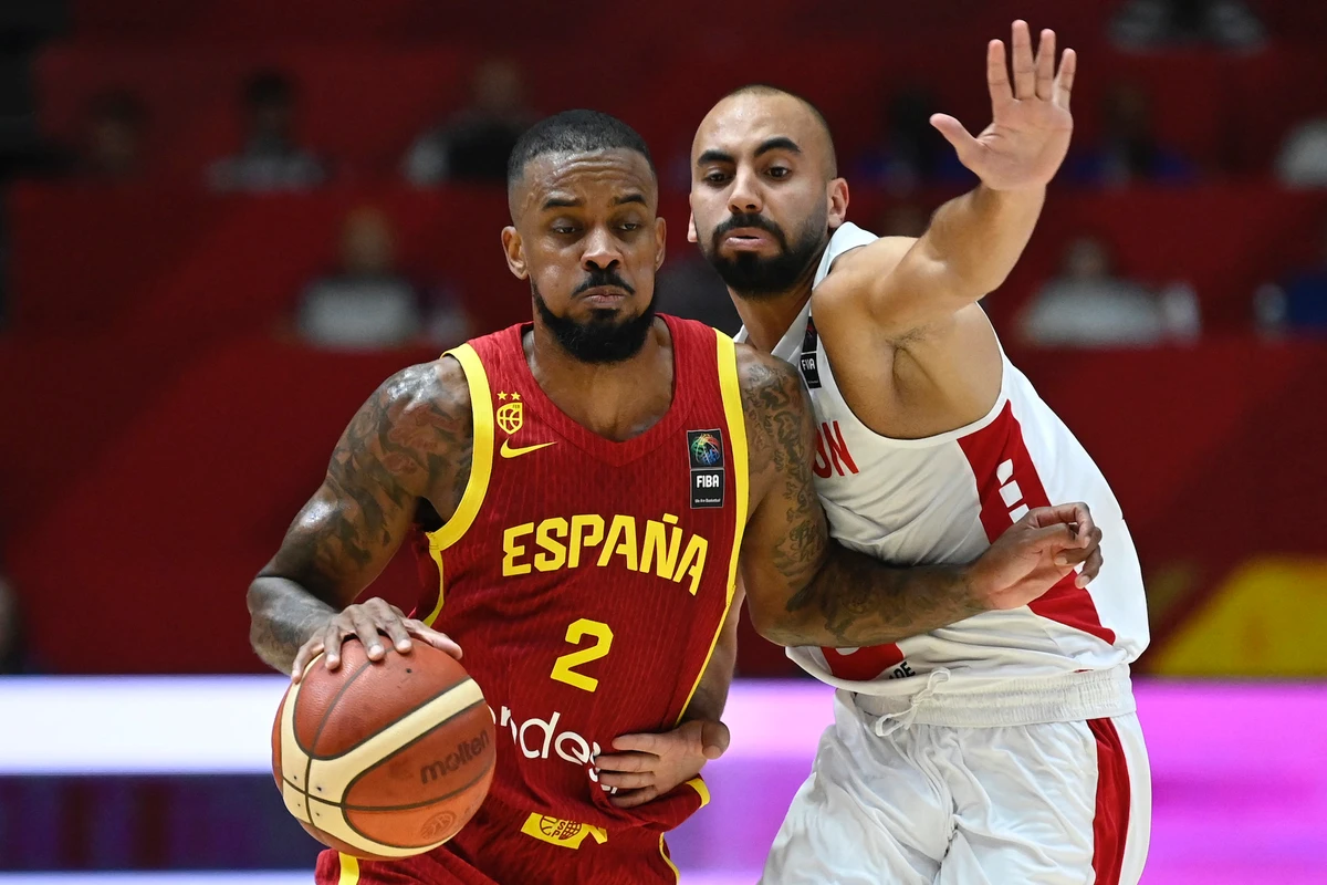 Spain's guard #02 Lorenzo Brown drives against Lebanon's guard #10 Ali Mansour during the 2024 FIBA Olympic Qualifying Tournament basketball match between Finland and Bahamas in Valencia, on July 2, 2024. (AFP)
