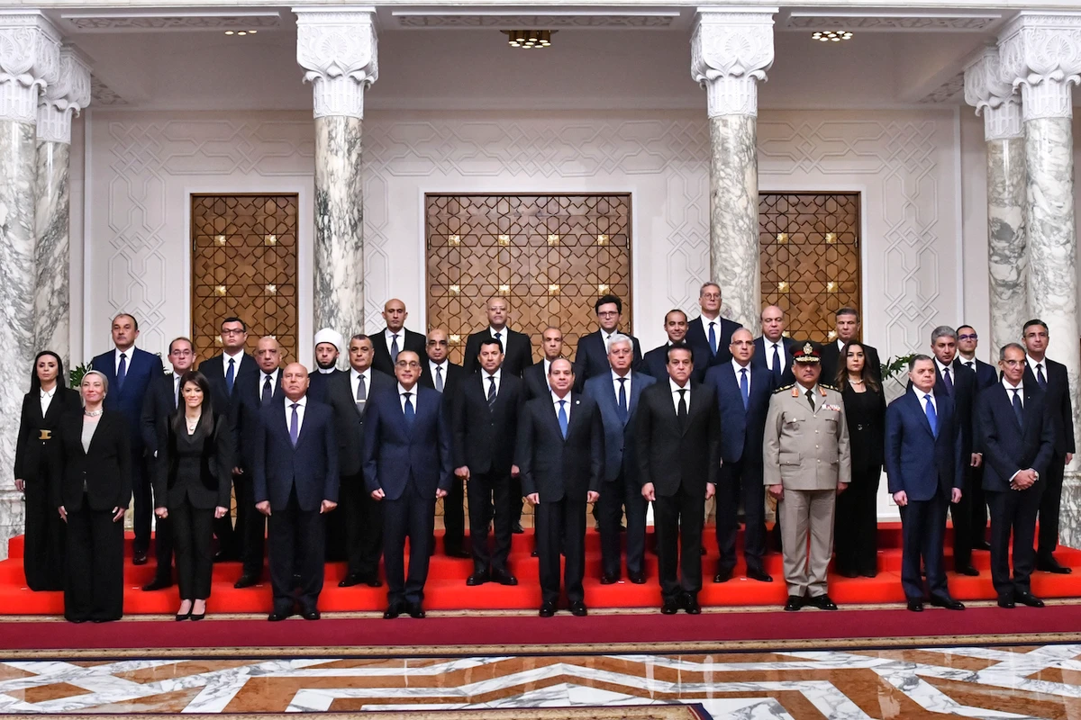 Egyptian President Abdel-Fattah El-Sissi poses with Egypt’s new cabinet, led by Prime Minister Mostafa Madbouly, fourth left, at Al-Ittihadiya Palace in Cairo, Egypt. (AP)