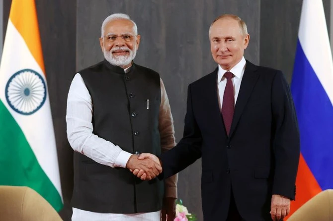 Russian President Vladimir Putin, right, and Indian Prime Minister Narendra Modi pose for a photo shaking hands prior to their talks on the sidelines of the Shanghai Cooperation Organization (SCO) summit in Samarkand, Uzbekistan, Sept. 16, 2022. (AP/File)
