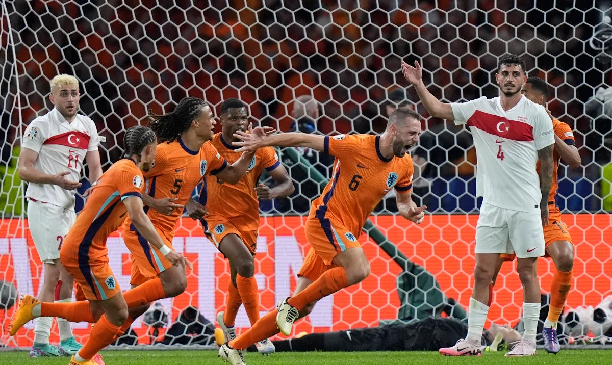 Stefan de Vrij of the Netherlands, second right, celebrates after scoring his sides first goal scored his side first goal during the quarterfinal match between the Netherlands and Turkey at the Euro 2024 soccer tournament in Berlin, Germany, Saturday, July 6, 2024. (AP)