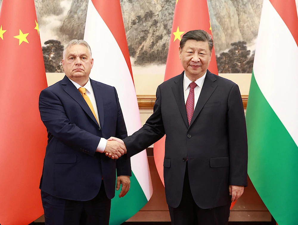 Chinese President Xi Jinping, right, meets Hungary’s Prime Minister Viktor Orban at the Diaoyutai State Guesthouse in Beijing on July 8, 2024. (China Daily via Reuters)