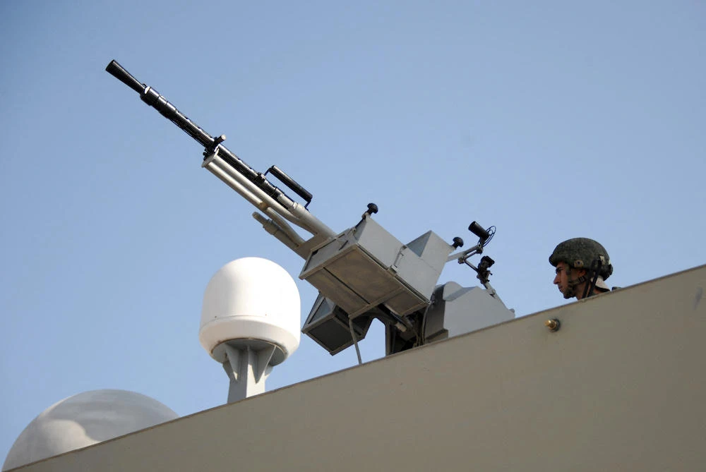 Above, a soldier keeps watch aboard one of Russian corvettes at a naval base in the Syrian Mediterranean port of Tartus on September 26, 2019. (AFP file photo)