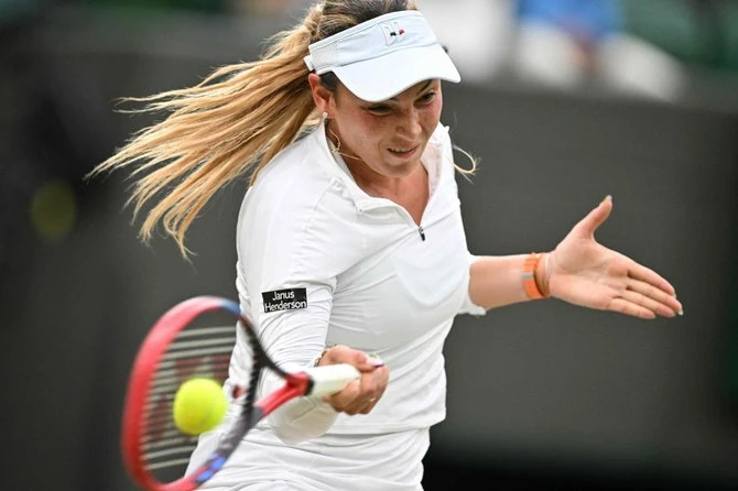 Croatia’s Donna Vekic returns the ball to New Zealand’s Lulu Sun during their women’s singles quarter-finals tennis match on the ninth day of the 2024 Wimbledon Championships at The All England Lawn Tennis and Croquet Club in Wimbledon, on Jul. 9, 2024. (AFP)