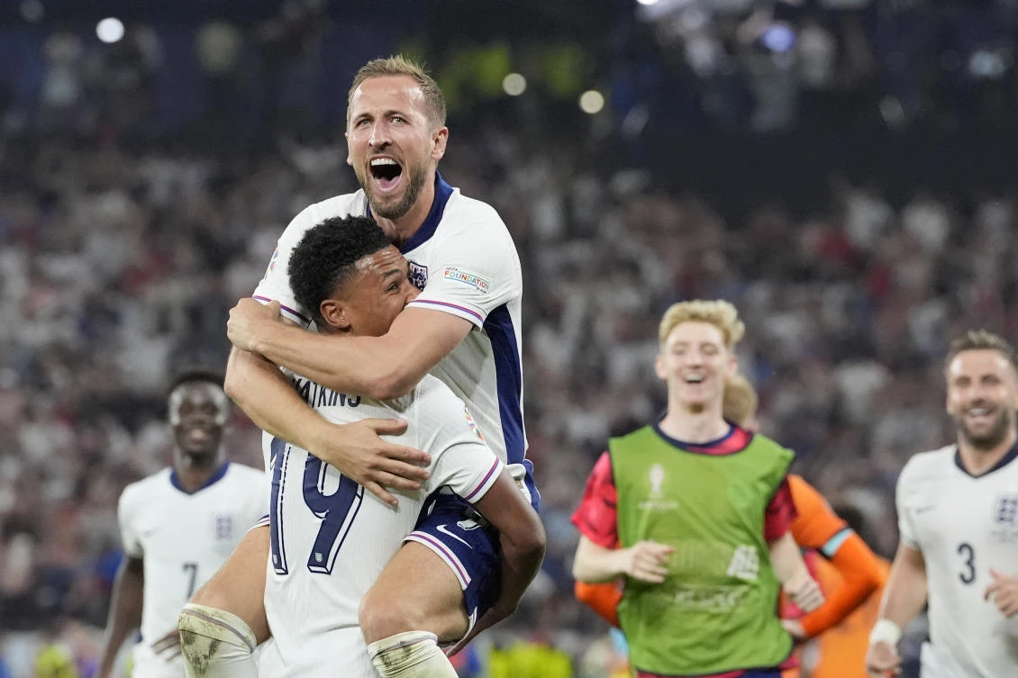 England's Harry Kane celebrates in the arms of teammate Ollie Watkins at the end of their semifinal match against the Netherlands at the Euro 2024 in Dortmund on Jul. 10, 2024. (AP)