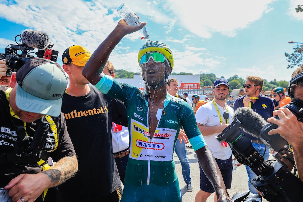 Biniam Girmay, wearing the best sprinter’s green jersey, cools off after the 12th stage of the Tour de France cycling race over 203.6 kilometers with start in Aurillac and finish in Villeneuve-sur-Lot, France, Thursday. (AP)