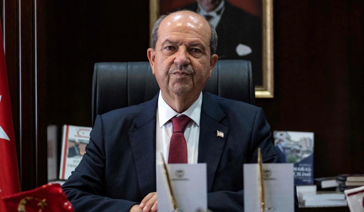 Turkish-Cypriot leader Ersin Tatar poses behind his desk at his office in the northern part of Cyprus' divided capital Nicosia on July 11, 2024. (AFP)