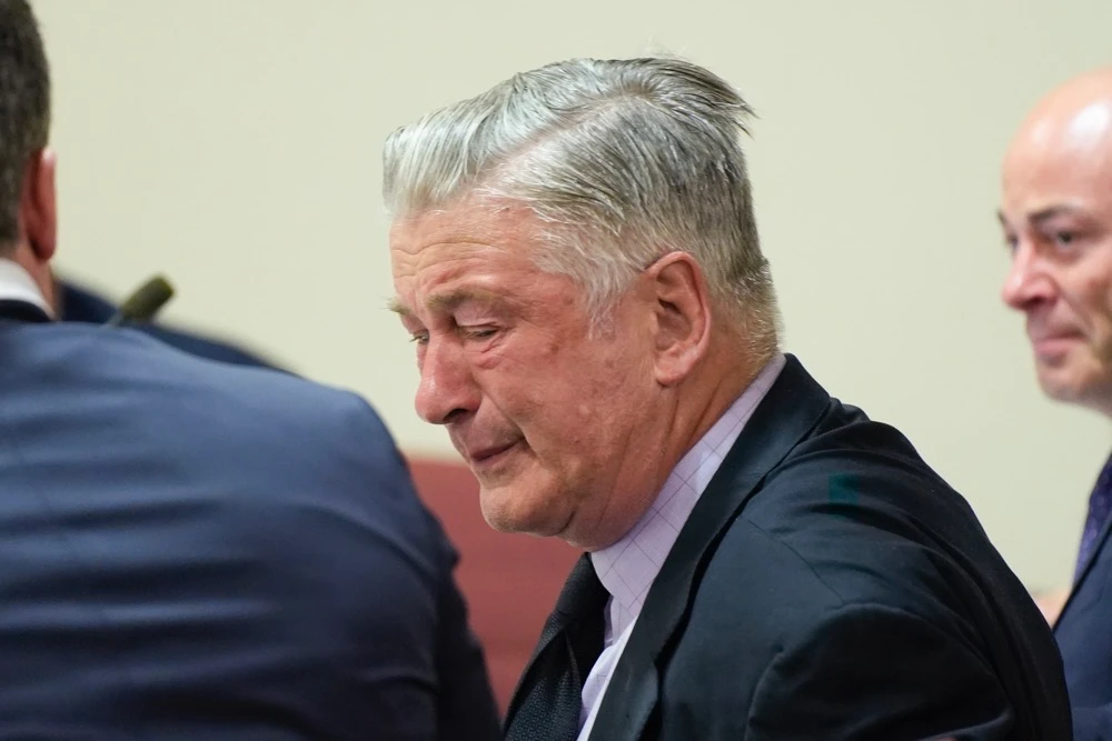 Alec Baldwin reacts after the judge dismissed the case against the actor. (AP)