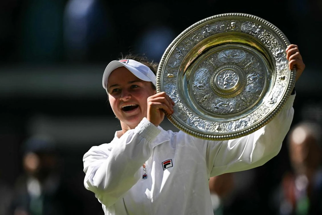 Czech Republic’s Barbora Krejcikova poses with the winner’s trophy, the Venus Rosewater Dish, after winning against Italy’s Jasmine Paolini during their women’s singles final tennis match of the 2024 Wimbledon Championships. (AFP)
