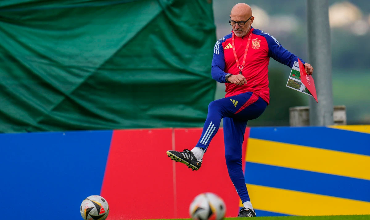 Spain's head coach Luis de la Fuente kicks the ball during a training session ahead of Sunday's Euro 2024, final soccer match against England in Donaueschingen, Germany, Saturday, July 13, 2024. (AP)