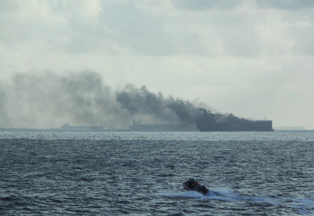 A handout image shows the RSS Supreme’s rigid-hulled inflatable boat in the vicinity of the burning vessels following a fire on two oil tankers about 55km northeast of the Singaporean island of Pedra Branca on July 19, 2024. (Singapore Navy via Reuters)