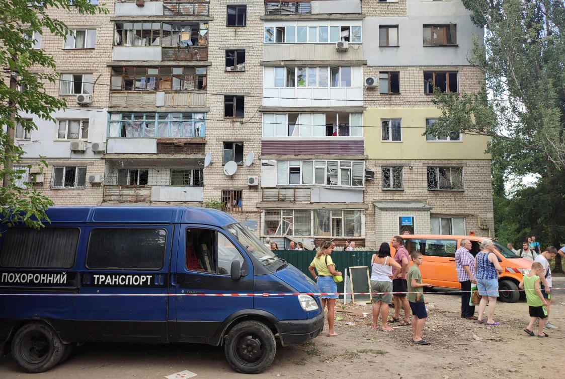 Local residents stand near their residential building damaged during a a Russian missile attack, amid Russia's attack on Ukraine, in Mykolaiv, Ukraine July 19, 2024. (Reuters)