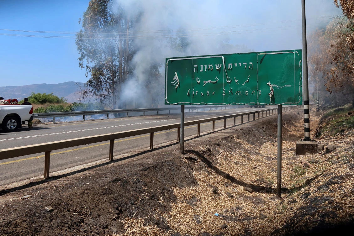 Smoke rises from a fire after Hezbollah fired a barrage of projectiles towards Israel from Lebanon, amid cross-border hostilities between Hezbollah and Israeli forces, at the entrance to Kiryat Shmona in northern Israel, July 17, 2024. (Reuters)