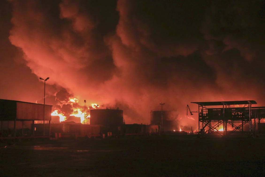 Oil tanks burn at the port in Hodeidah, Yemen, Saturday, July 20, 2024. The Israeli army said it has struck several Houthi targets in western Yemen following a fatal drone attack by the rebel group in Tel Aviv the previous day. (AP)