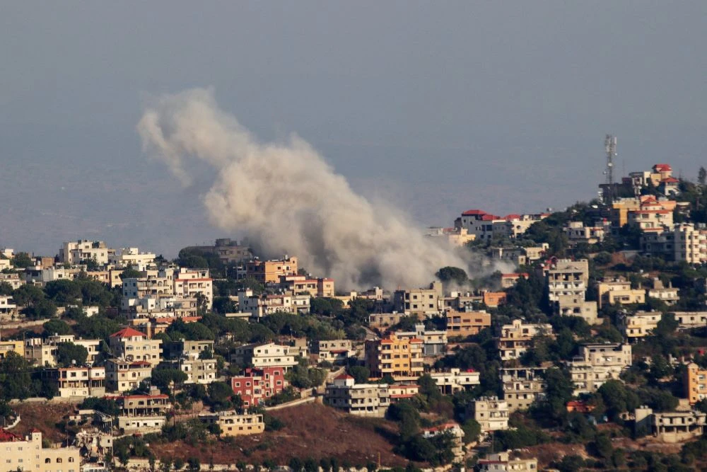 Smoke billows from a site targeted by Israeli shelling in the southern Lebanese village of Khiam in Marjeyoun on July 22, 2024. (AFP)