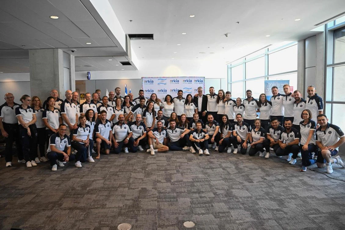 Members of Israel’s delegation to the Paris 2024 Olympic and Paralympic Games pose for a group picture ahead of departure at the Ben Gurion airport near Tel Aviv on July 22, 2024. (AFP)