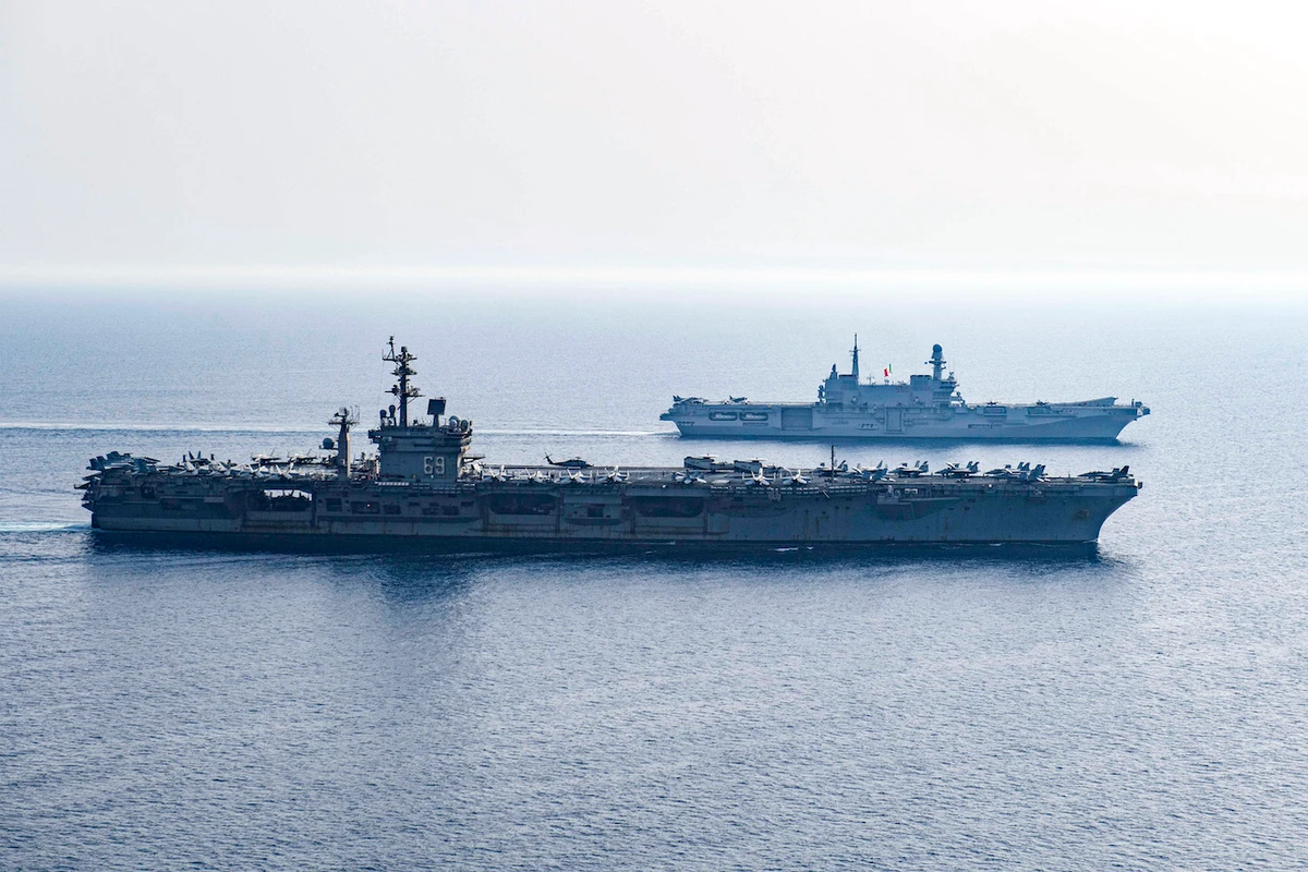 US Navy Nimitz-class aircraft carrier USS Dwight D. Eisenhower (CVN 69) and Italian aircraft carrier ITS Cavour (CVH 550) sail in formation in Red Sea as part of mission to support maritime security in Middle East region. (File/AFP)