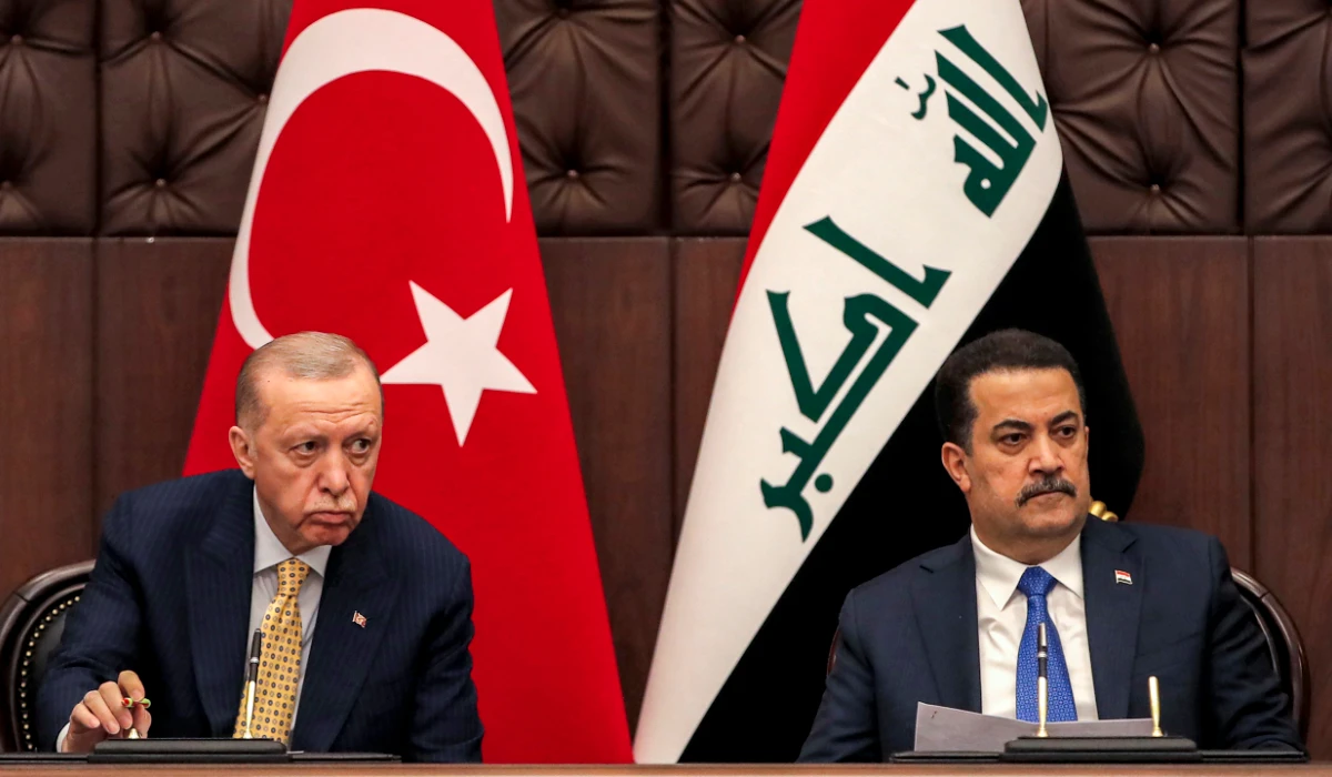 Iraq's Prime Minister Mohammed Shia al-Sudani, right, and Turkey's President Recep Tayyip Erdogan attend a meeting to sign mutual agreements in Baghdad, on April 22, 2024. (AP)