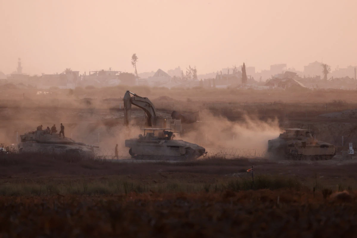 Israeli military vehicles maneuver near the Israel-Gaza border on July 25, 2024, amid the conflict between Israel and Hamas. (REUTERS)