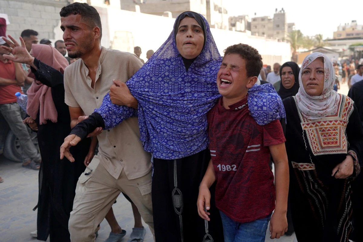 istressed Palestinians arrive at the Nasser hospital after Israeli forces targeted the northeastern district of Khan Yunis, in the southern Gaza Strip, on July 24, 2024 (AFP)