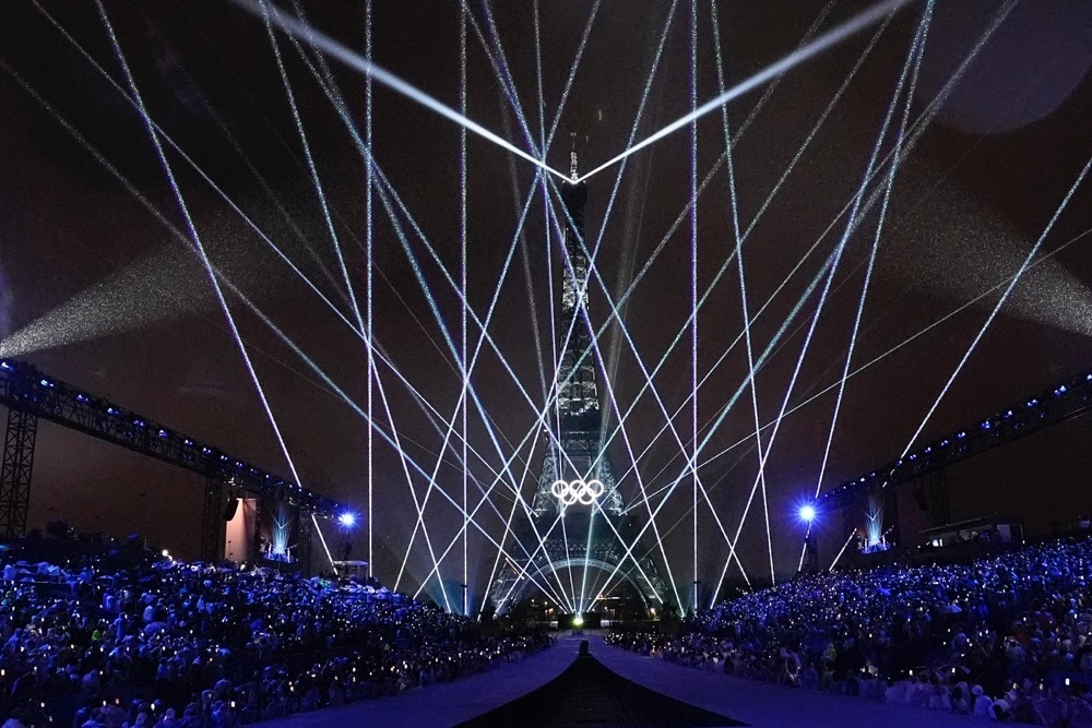 Amid downpour, Paris welcomes the world with unique Olympic opening
