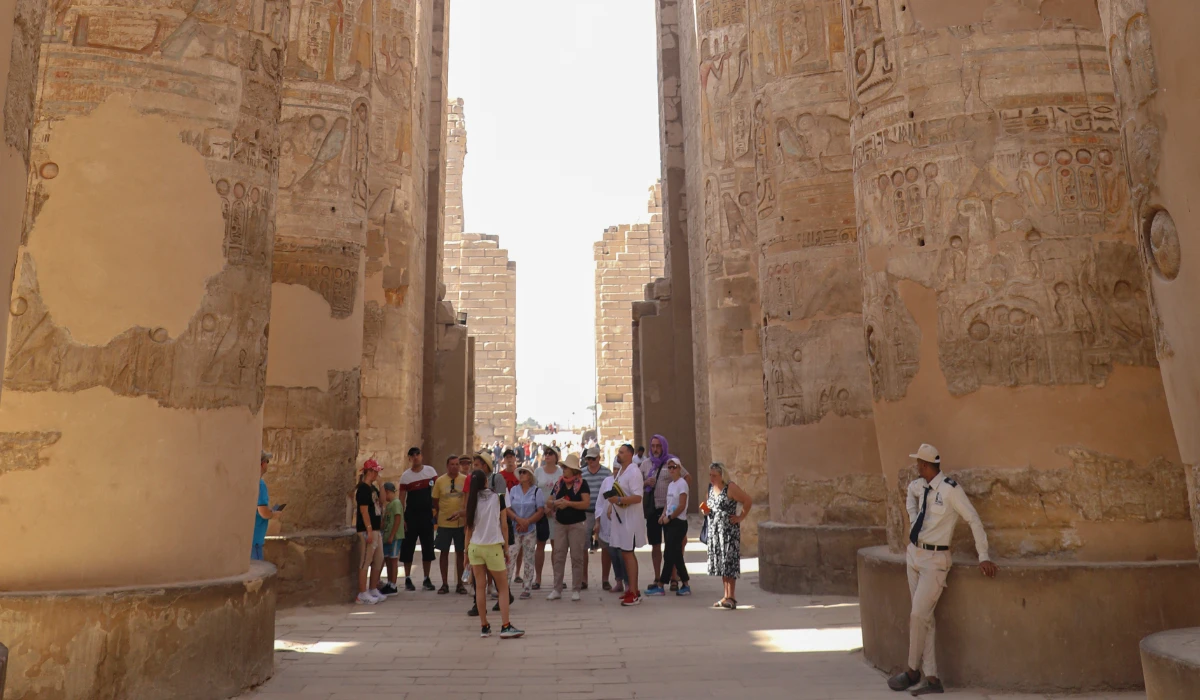 Tourists visit the Karnak Temple on Friday, Nov. 26, 2021, After one day the reopening ceremony of the Avenue of Sphinxes commonly known as El Kebbash Road in Luxor, Egypt. (AP file photo)