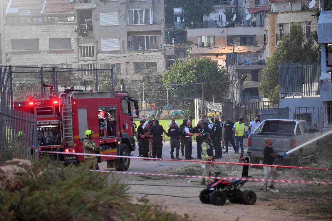 Israeli officials respond after rockets were launched across Lebanon’s border with Israel which, according to Israel’s ambulance services critically injured multiple people at a soccer pitch in Majdal Shams, a Druze village in the Israeli-occupied Golan Heights, July 27 2024. (Reuters)