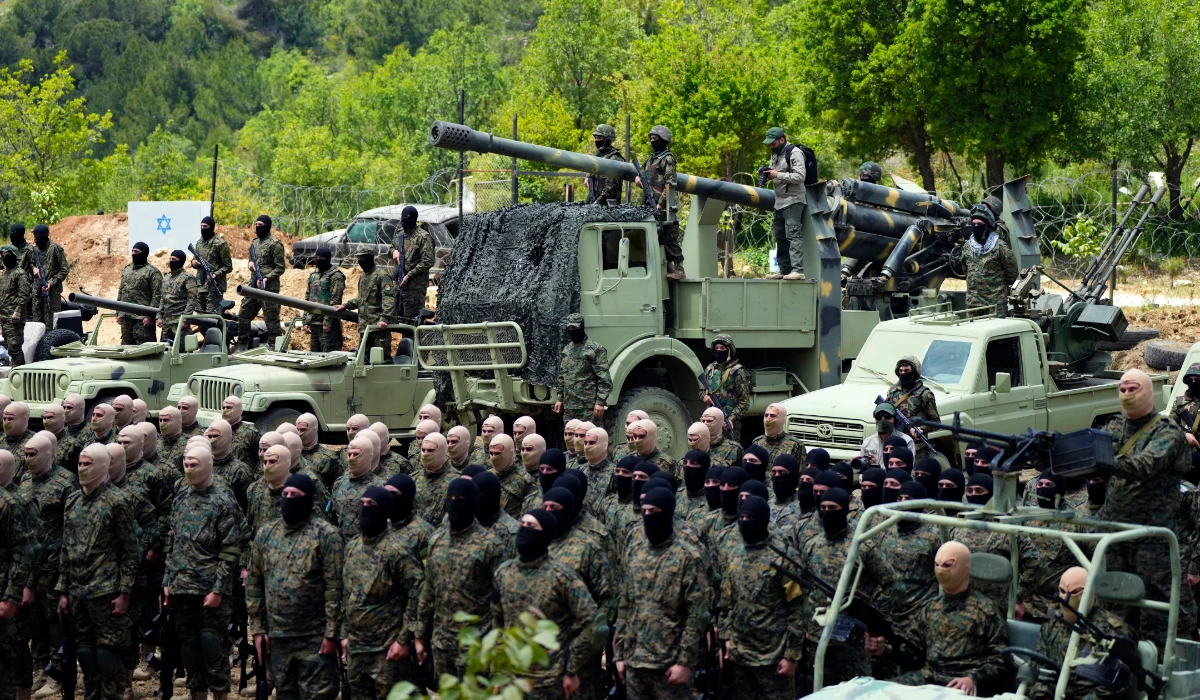 Fighters from the Lebanese militant group Hezbollah carry out a training exercise in Aaramta village in the Jezzine District, southern Lebanon, Sunday, May 21, 2023. (AP)