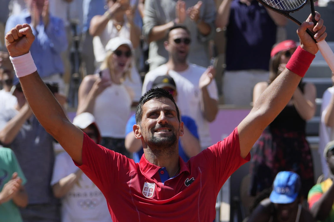 Serbia’s Novak Djokovic celebrates after defeating Spain’s Rafael Nadal in their men’s singles second round match at the Roland Garros stadium at the 2024 Summer Olympics, Monday, July 29, 2024, in Paris, France. Novak Djokovic dominated rival Rafael Nadal to win 6-1, 6-4 at the Paris Olympics in the second round. (AP)
