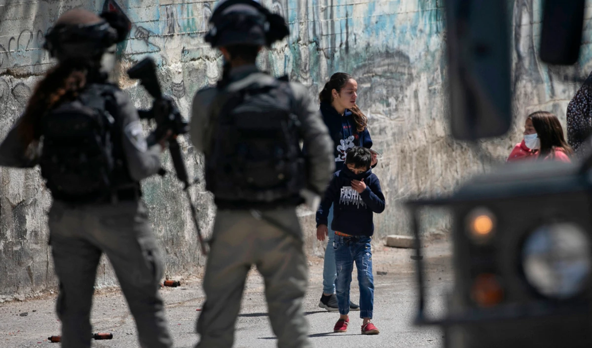 Israeli security members deploy as Palestinians commemorating land day demonstrate in protest of settler visits to archaeological and historical sites in the Palestinian village of Sebastia, northwest of Nablus in the occupied West Bank, on March 30, 2021. (AFP/File)