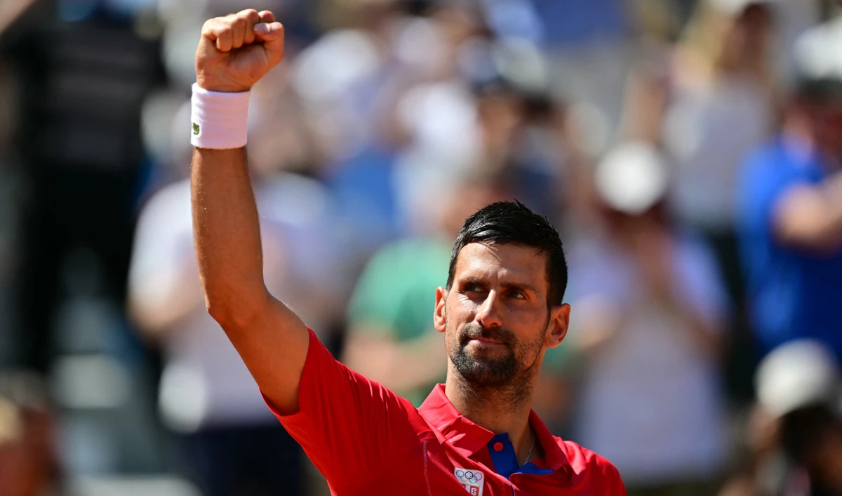 Serbia's Novak Djokovic reacts to his win over Spain's Rafael Nadal in their men's singles second round tennis match on Court Philippe-Chatrier at the Roland-Garros Stadium at the Paris 2024 Olympic Games, in Paris on July 29, 2024. (AFP)