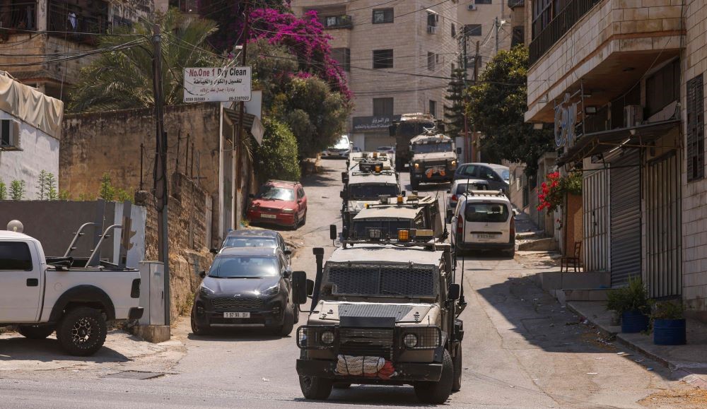 Israeli military vehicles during a raid in Nablus, occupied West Bank, Aug. 19, 2024. (AFP)