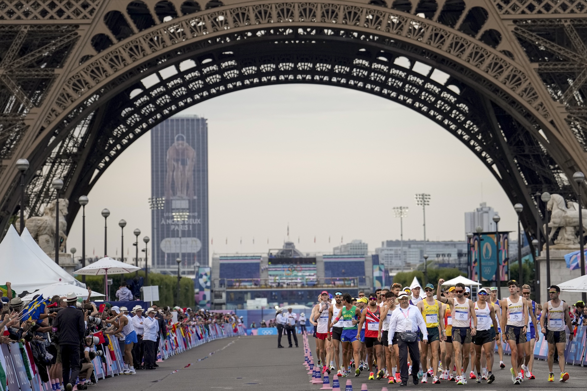 Fans cheer as athletes line up to start the men's 20km race walk at the 2024 Summer Olympics Thursday in Paris. (AP)