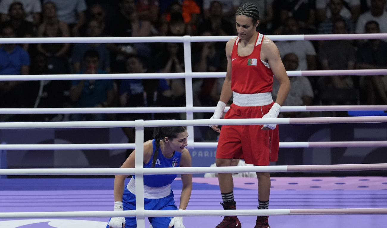 Algeria's Imane Khelif, right, and Italy's Angela Carini at the end of their women's 66kg preliminary boxing match at the 2024 Summer Olympics Thursday in Paris. (AP)