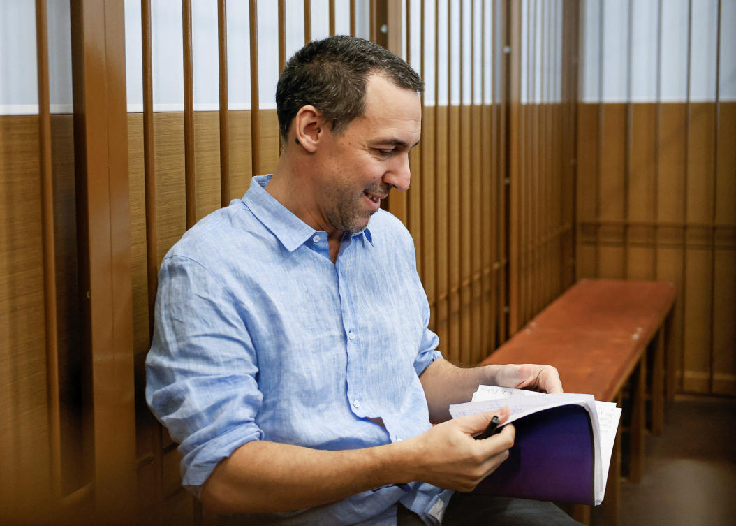 French researcher Laurent Vinatier, who is suspected of illegally collecting sensitive Russian military information, sits inside an enclosure for defendants before a court hearing in Moscow on July 31, 2024. (Reuters)