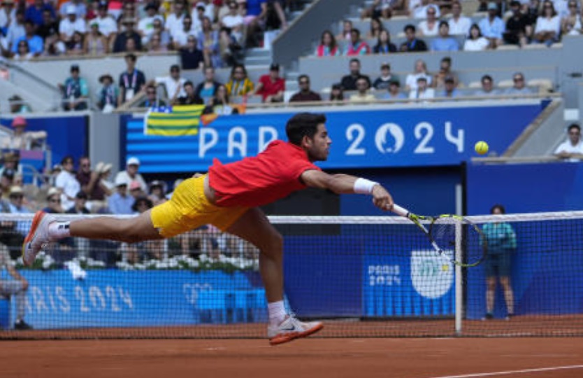 Carlos Alcaraz of Spain returns a shot to Felix Auger-Aliassime of Canada during their men’s singles semifinals tennis match, at the 2024 Summer Olympics, on Aug. 2, 2024, at the Roland Garros stadium in Paris. (AP)