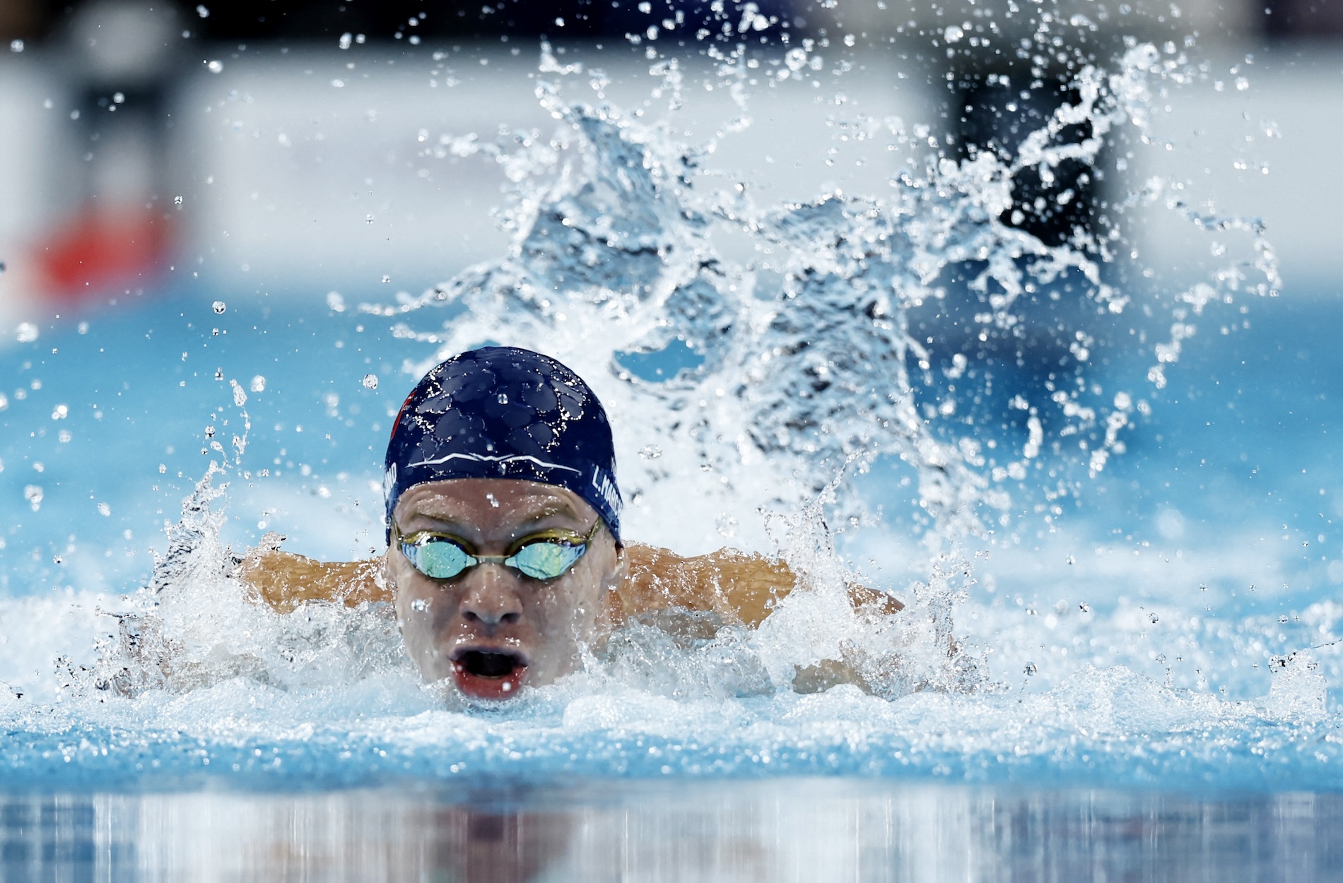 Leon Marchand of France on his way to winning the men’s 200m individual medley gold and setting an Olympic record at the Paris 2024 Olympics Friday. (Reuters)